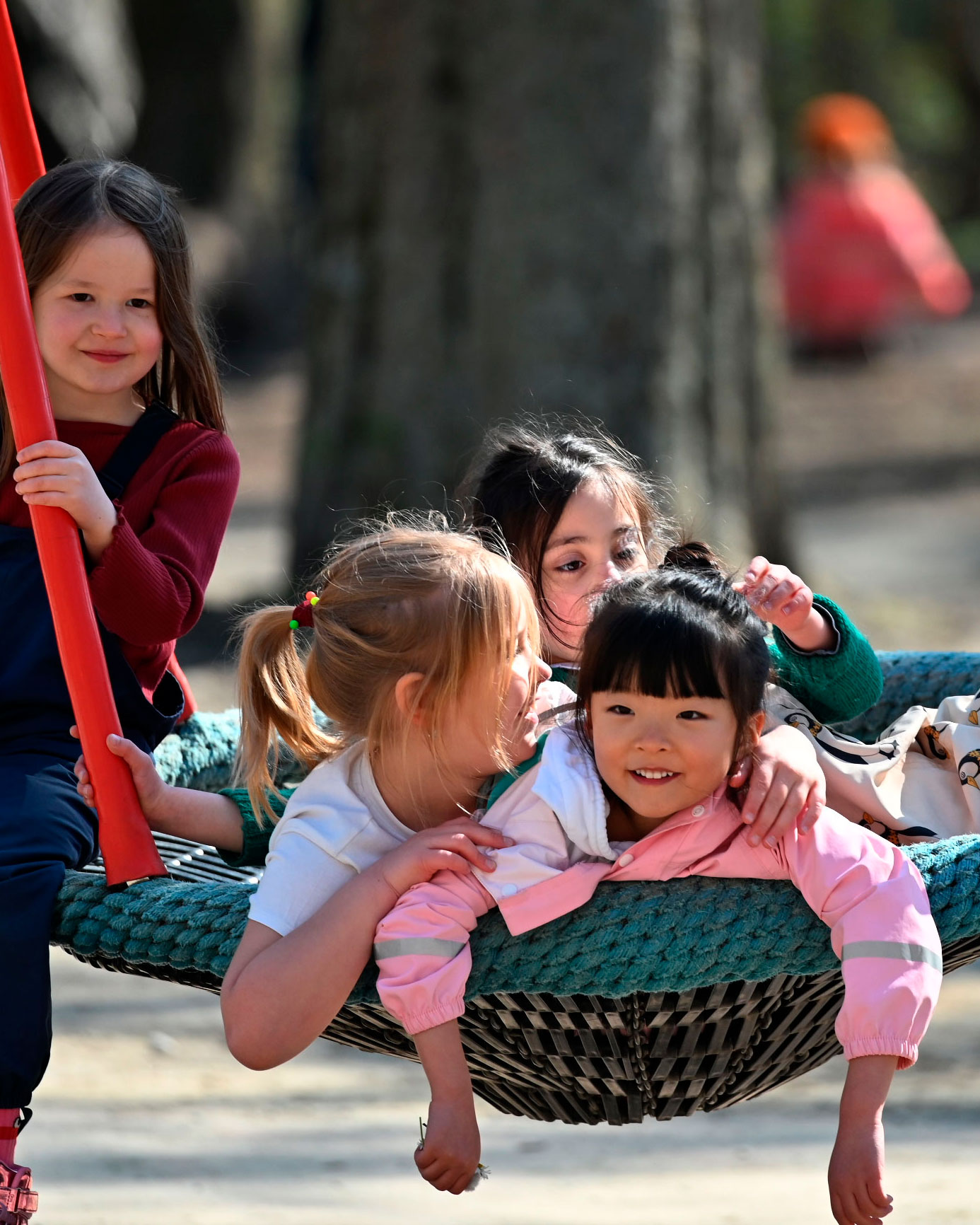 International children playing in the park with English language