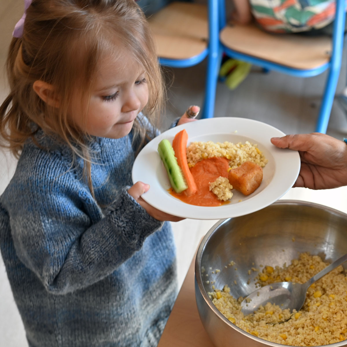 Montessori child receiving first class food in international kindergarten Munich
